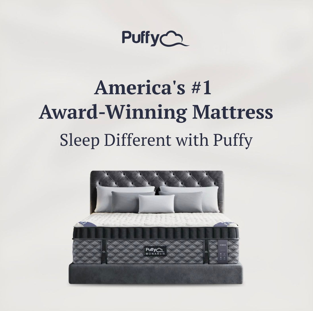 Puffy Monarch luxury hybrid mattress on tufted bed frame in showroom setting – available to try in-store at The Online Mattress Store near Green Bay, WI