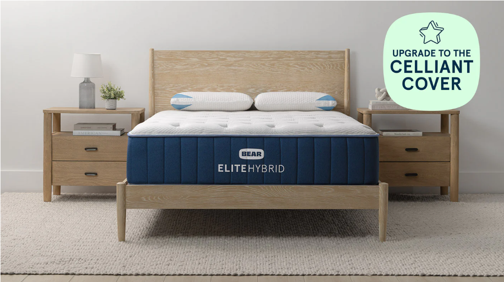 Bear Elite Hybrid mattress in a bedroom setting with wooden furniture and a 'Celliant Cover' upgrade option.